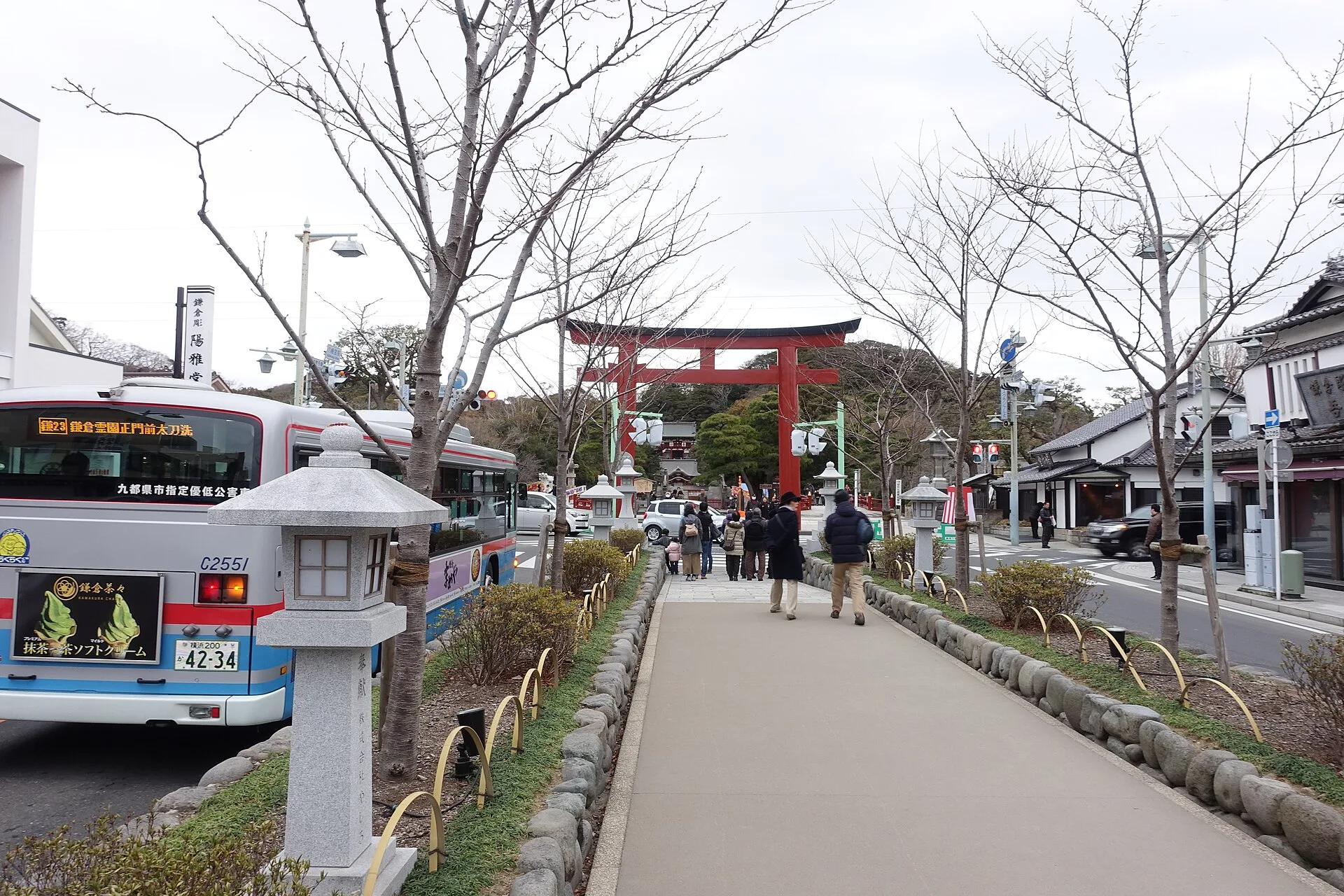 Winter view along the raised Dankazura path toward a red torii