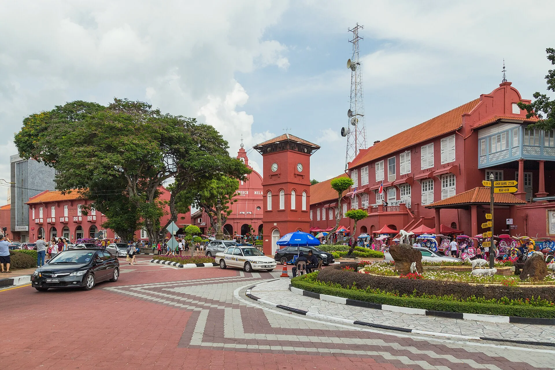Red colonial-era buildings and visitors at Dutch Square