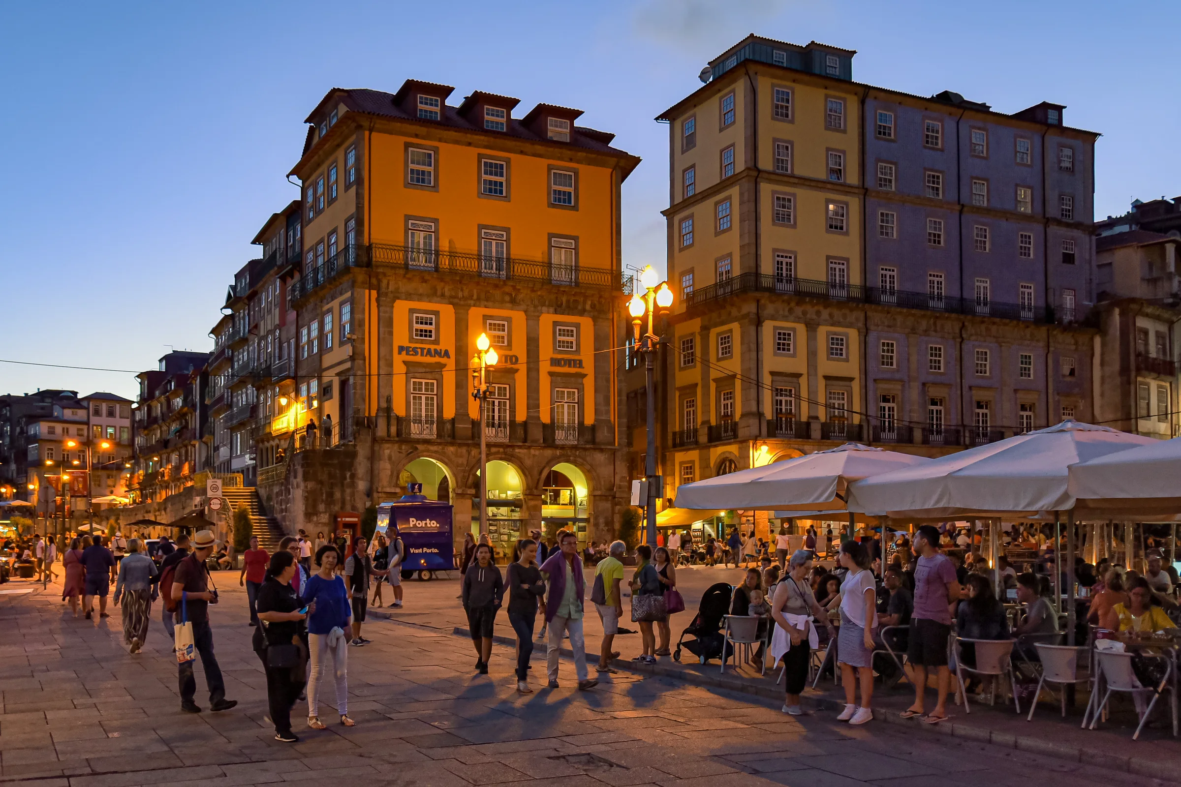 Ribeira square, waterfront terraces and façades at dusk