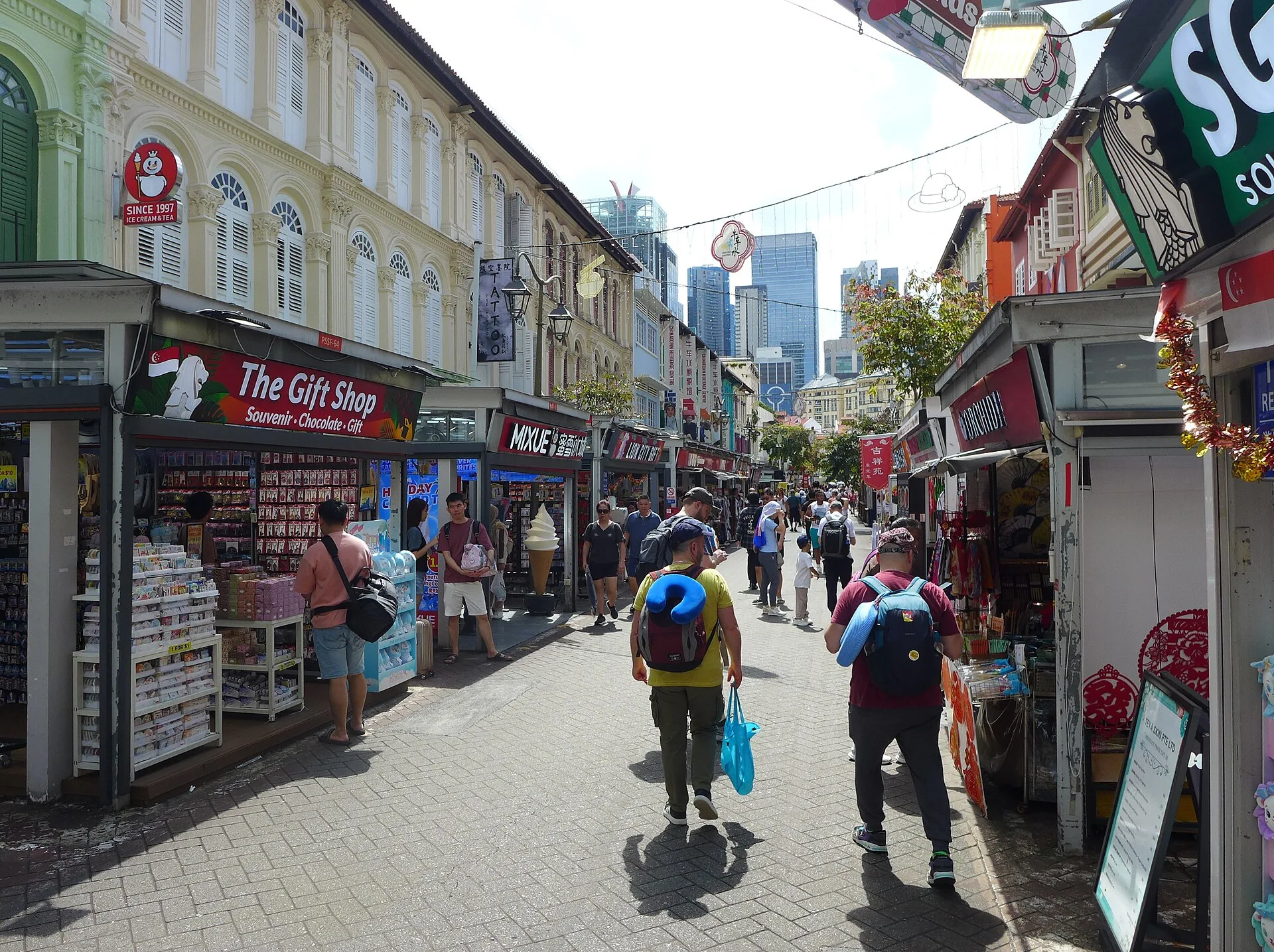 Shop houses and pedestrians along Pagoda Street