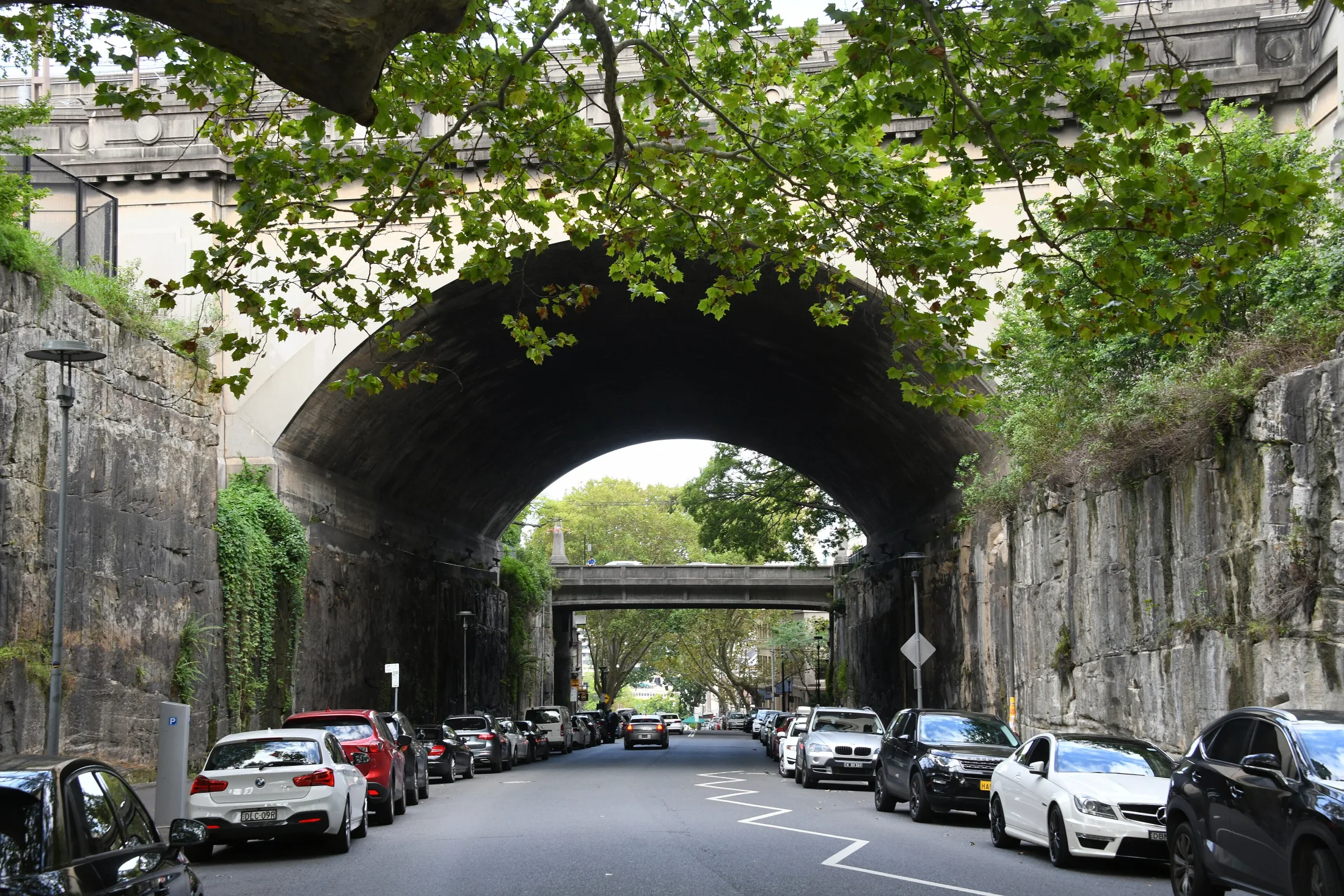 Argyle Street passing between cut sandstone walls beneath an arch